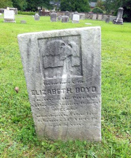 The headstone of Elizabeth Boyd, a native of Donegal, Ireland who died here at the younh age of 26. There's an intriguing symbol at the top of her headstone: rain of sadness? sun shining down? Very interesting. (DDD photo)