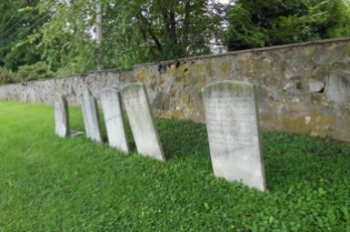 Older graves toward the back stone wall of the cemetery. (DDD photo)